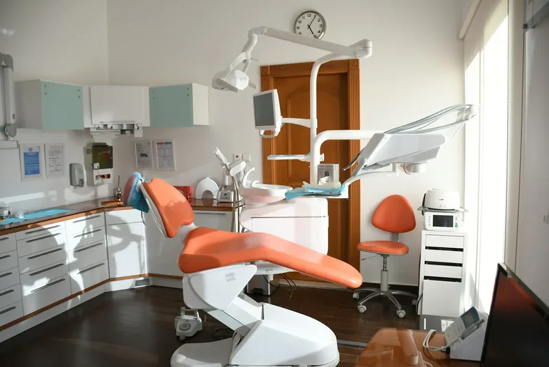 A dental chair in a bright room