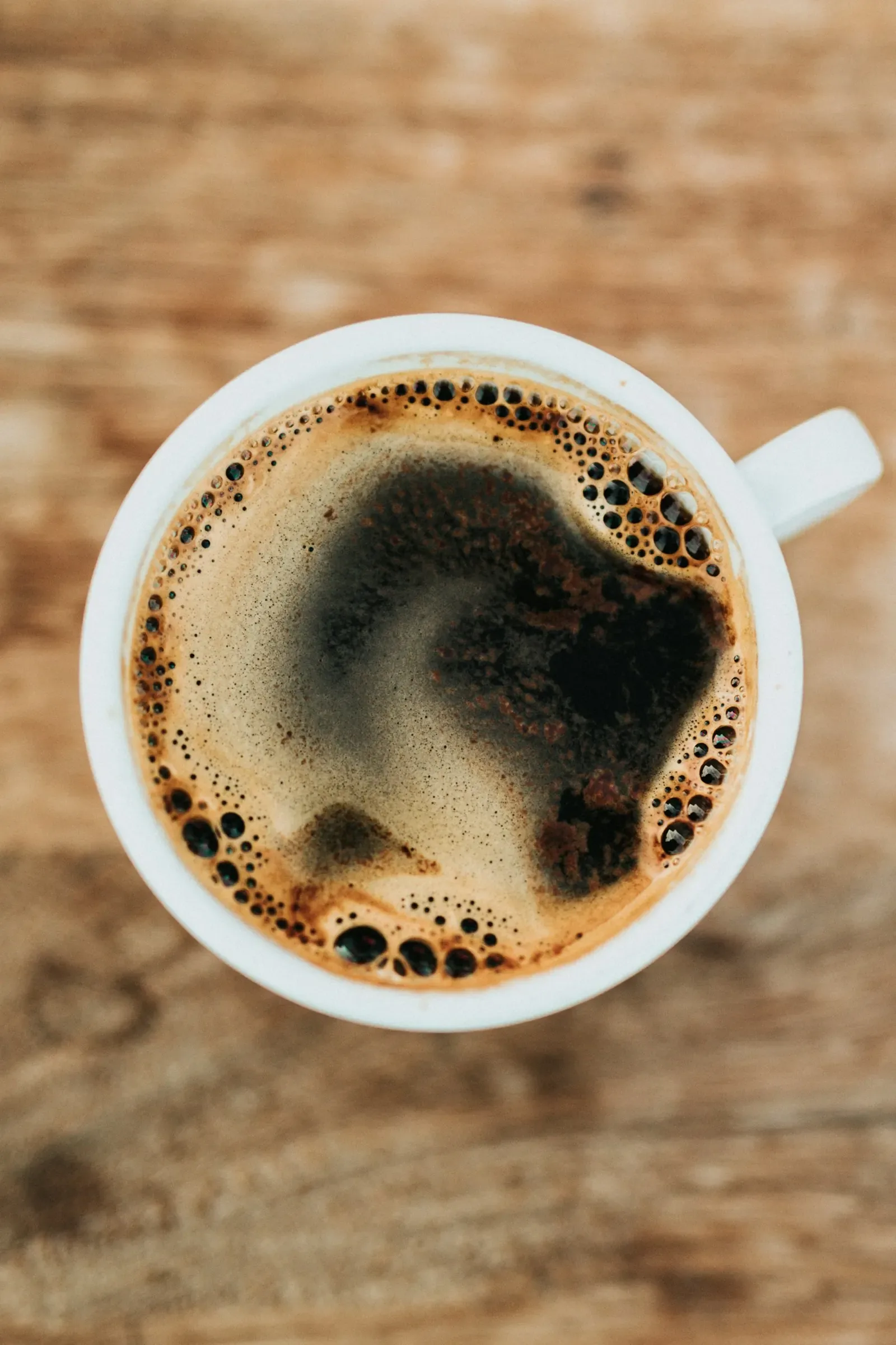 Coffee and a notebook on a café table