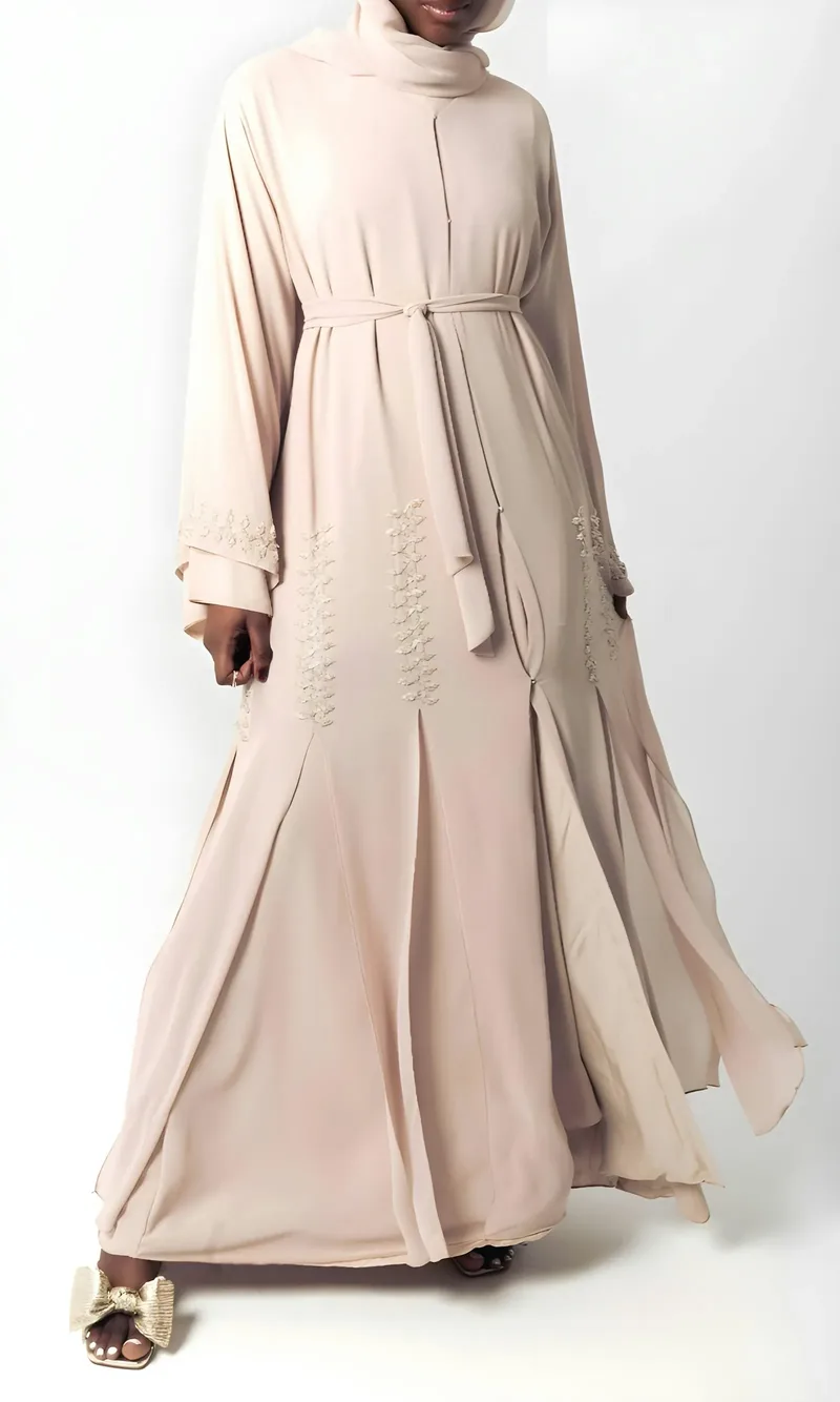 A beige abaya with fine embroidery